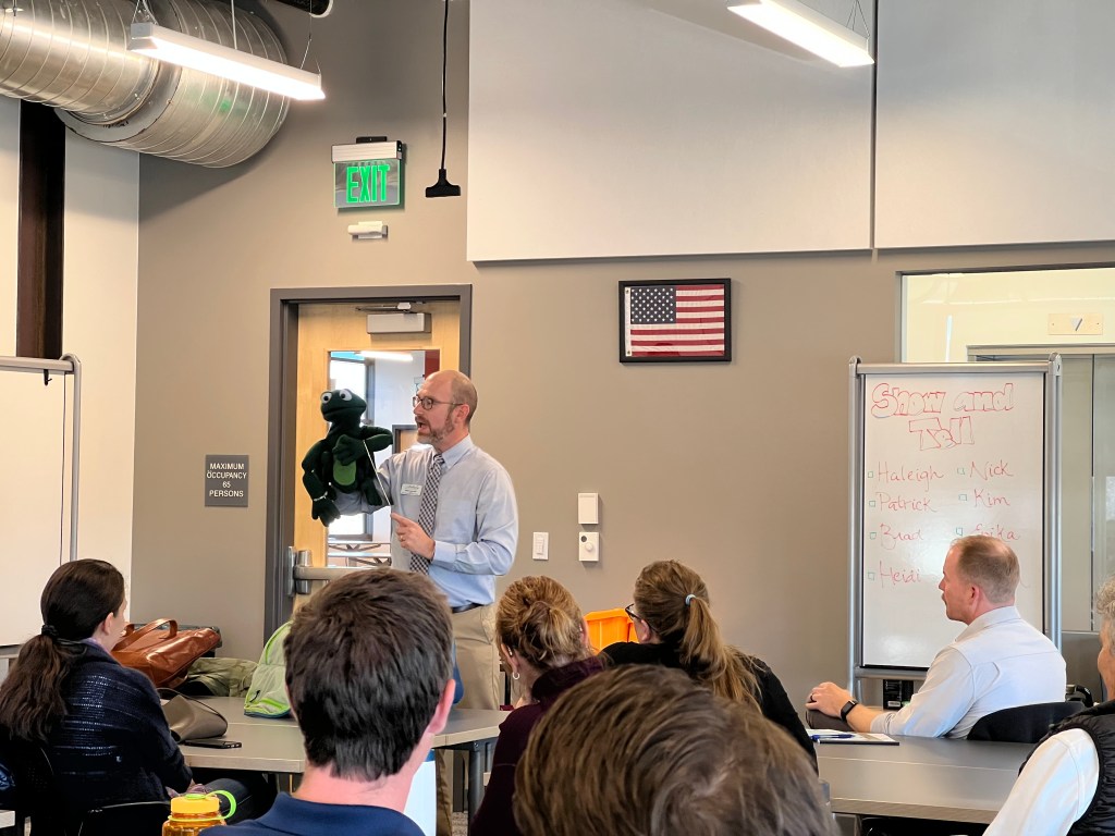 Rev. Bradley Laurvick sharing one of his You Matter Zone puppets