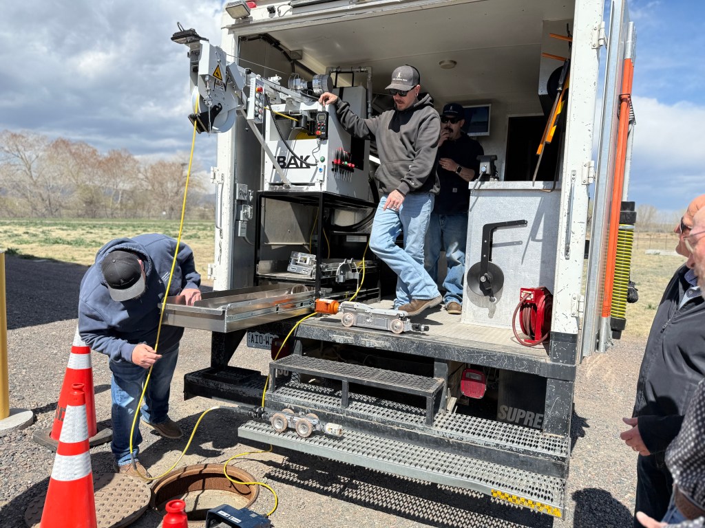 Boxelder Sanitation District Staff demos lowering the robot into place